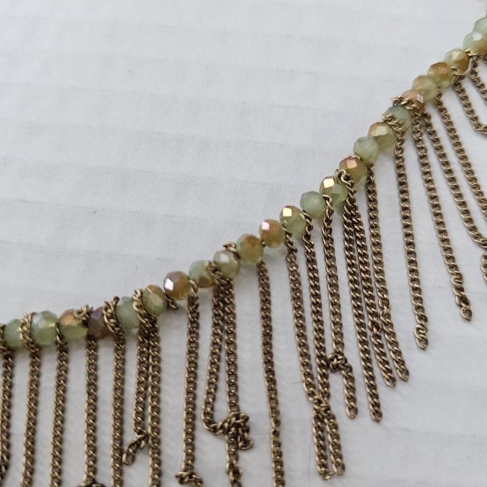 Freedom gold and green long necklace with a boho feeling fringe. - Picture 5 of 12